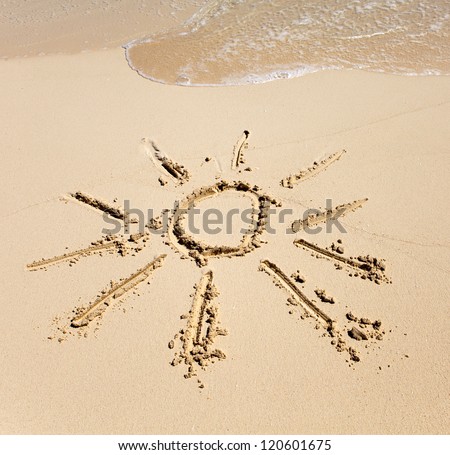 The sun - a picture on sand