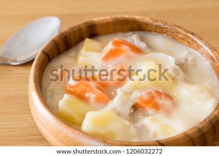 White stew in a wooden dish