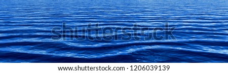 Deep blue gentle ocean waves panorama background