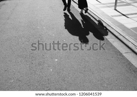 shadow of couple in street