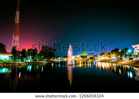 Landscape night lights city and beautiful fountain river in Loei Thailand