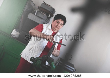 Woman mechanic in workshop