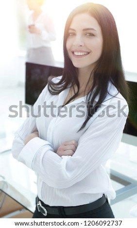 perspective successful young woman in the office