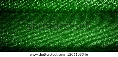 Texture, background, pattern. The fabric is Dark green coated with a metallic silver thread. These fabrics are ideal for any project, wallpaper, all design solutions. and many uses of ships