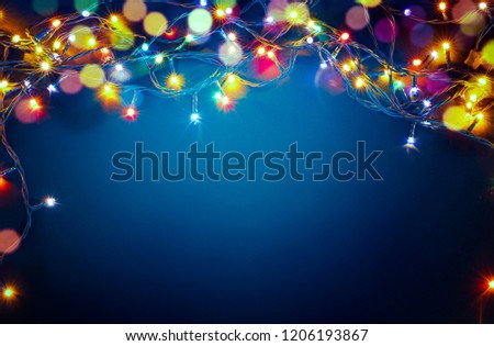 colorful christmas lights on blue background
