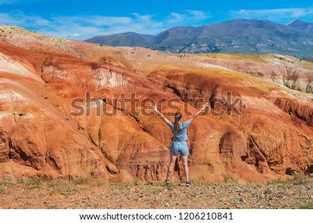 Woman in valley of Mars landscapes in the Altai Mountains, Kyzyl Chin, Siberia, Russia