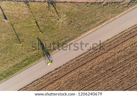bird view of a biker on the road