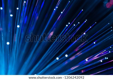 Colorful sparkling light particles. Abstract image. Shooting optical fiber with out focus.