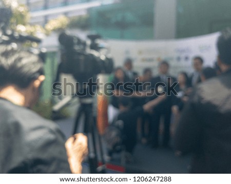 abstract blurry background of camera man shooting interviewing