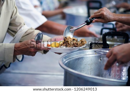 Donate food to hungry people, Concept of poverty and hunger Royalty-Free Stock Photo #1206249013