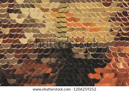 Fish scales golden shiny shimmers in different colors. Glamorous