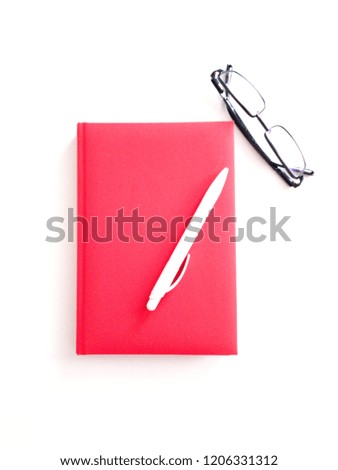 Red Planner And White Pen Stock Photo