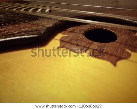 Mobile photo of a string musical instrument balalaika in macro.