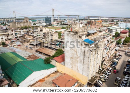 The under construction bridge across the Maputo Bay from Maputo to Katembe (Ponte de Maputo a Katembe), seen over high-rise buildings and streets of Maputo city centre, Southern Mozambique, Africa. 