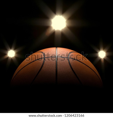 Basketball close-up on black background with bokeh, spotlights