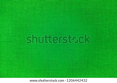 A close-up of bright green fabric texture Royalty-Free Stock Photo #1206442432