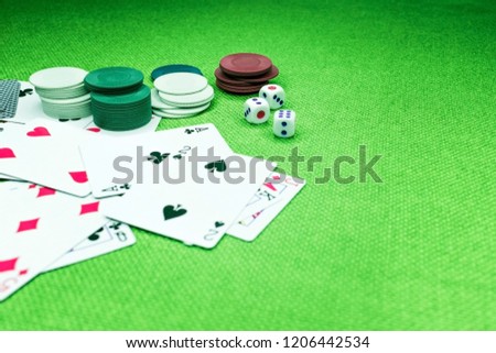 Casino poker chips colorful gaming pieces lie on the game table in the stack. Background for gambling casino, business, poker. Colorful casino poker chips for casino game on the table.Soft focus Royalty-Free Stock Photo #1206442534
