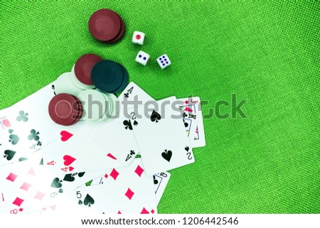 Casino poker chips colorful gaming pieces lie on the game table in the stack. Background for gambling casino, business, poker. Colorful casino poker chips for casino game on the table.Soft focus Royalty-Free Stock Photo #1206442546