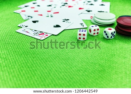 Casino poker chips colorful gaming pieces lie on the game table in the stack. Background for gambling casino, business, poker. Colorful casino poker chips for casino game on the table.Soft focus Royalty-Free Stock Photo #1206442549