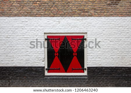 red warning sign on brick wall