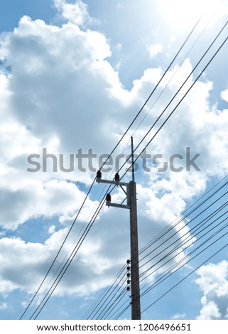 Electric Power Transmission With clouds and blue sky, High Voltage Power Lines Supplies Electricity to the City and Text