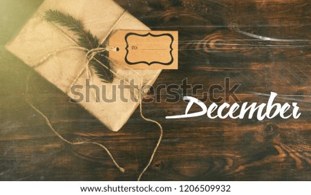 December text, on the background of the new year gift.