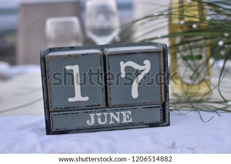 Wood blocks in box with date, day and month 17 June. Wooden blocks calendar