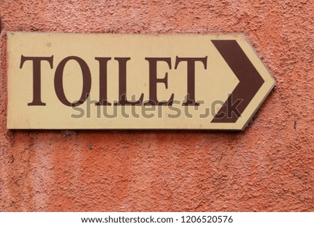 Toilet sign in the park