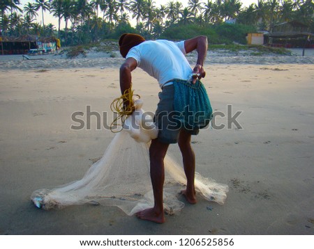 fisherman throwing net