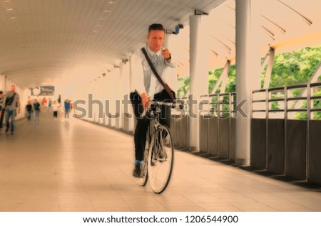 Businessman, going to work by bicycle.Handsome man enjoying city ride by bicycle.young businessman with his bicycle.