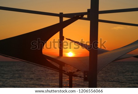 Magnificent sunset on the sea on a sunny warm autumn evening