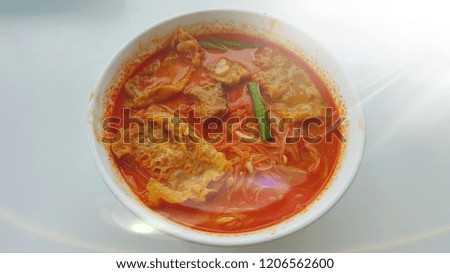 Laksa curry noodle is a spicy noodle soup popular in Peranakan cuisine. Edited with Stardust effects