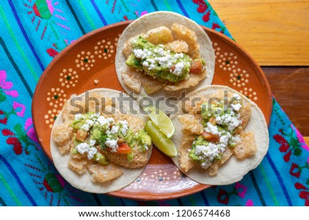 Mexican chicharron tacos with guacamole