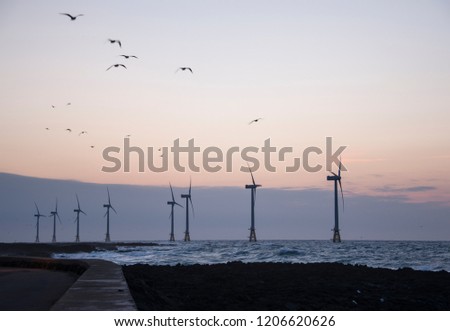 The wind generators in sunset view on Jeju Island in South Korea. 