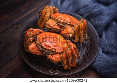 Two cooked hairy crabs on the table.