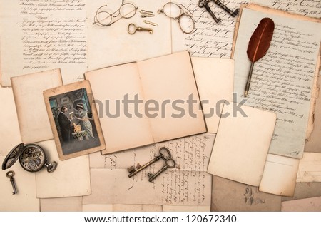 open book, antique accessories, old letters and postcards. nostalgic vintage new year's background