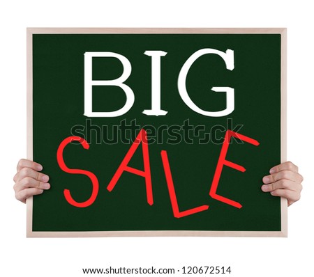 big sale on blackboard with hands