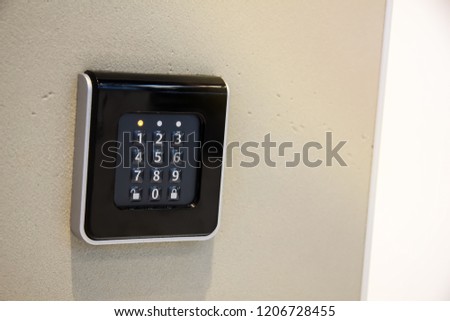 The smart home system with access control for fingerprint, key, NFC tags, enter a PIN code. Touch sensor keyboard on the wall at home