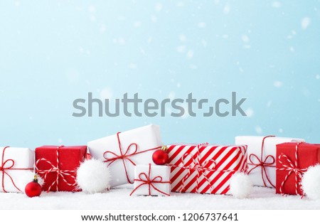 Christmas gift boxes on a bright blue background.