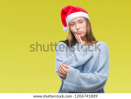 Young beautiful caucasian woman wearing christmas hat over isolated background thinking looking tired and bored with depression problems with crossed arms.