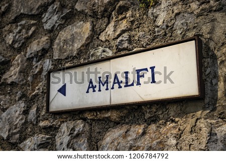 close-up of an ancient road sign of Ravello, indicating the direction to Amalfi. In the province of Salerno, on the Amalfi coast.