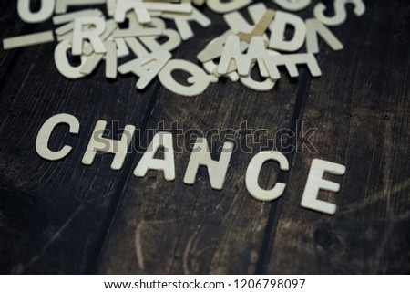 Chance word cube on wood background ,English language learning concept

