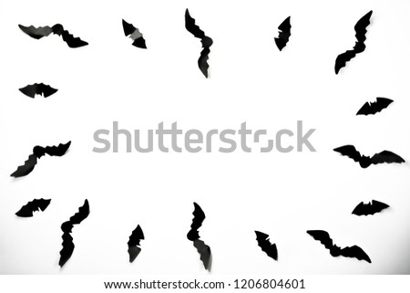 Halloween paper decorations concept. Black paper bats on a white background. Halloween concept.