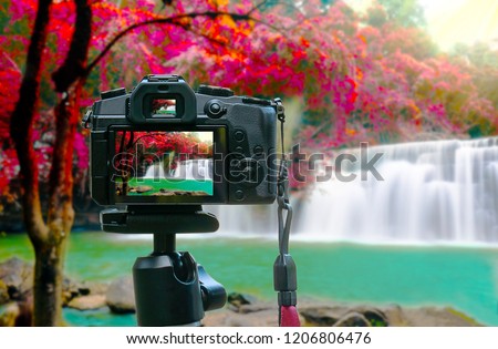Photo of beawtiful waterfall on camera display while shooting