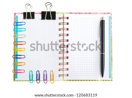 Notebook with stationary objects in the background