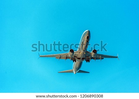 View of the plane against the blue sky, Hawaii, USA. Isolated on blue background. Copy space for text