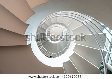 Perspective spiral staircase Royalty-Free Stock Photo #1206902554