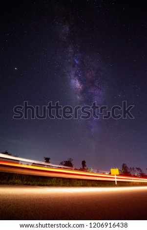 Milky way galaxy look up vertically, Have a car lighting ,Make it look beautiful.