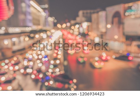 Vintage tone Abstract Blurred image of Road in night time  with light bokeh  for background usage.