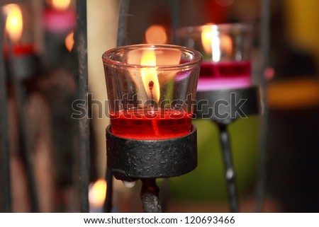 background of red candle in a glass